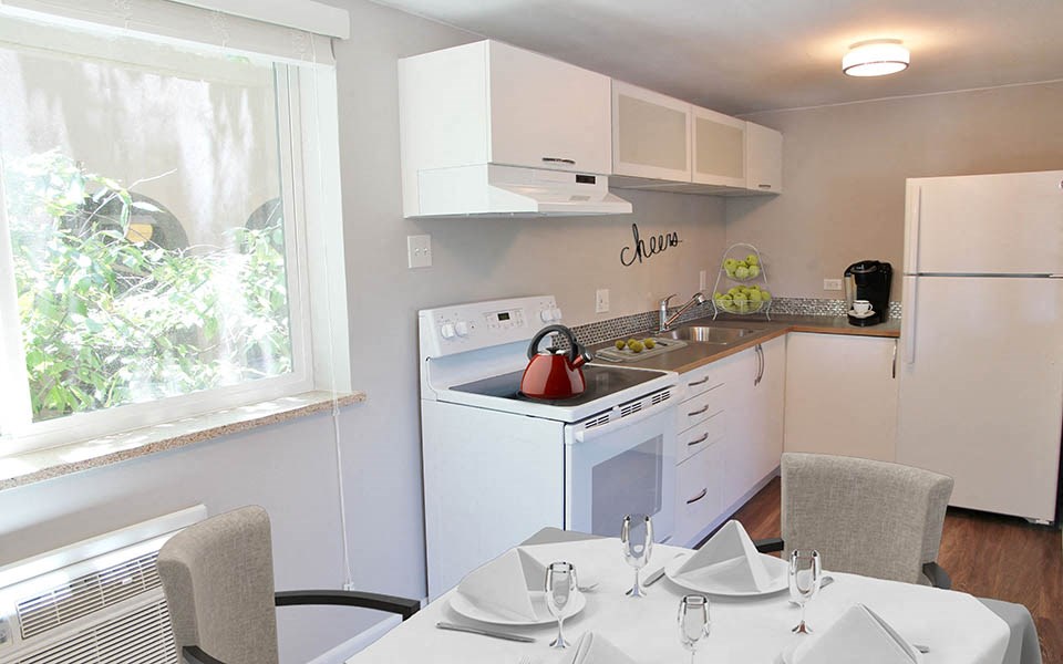 a kitchen with a table and a stove