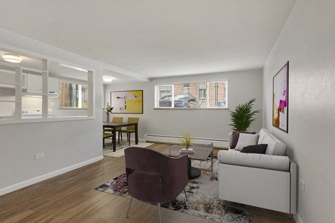 the living room of an apartment with a couch and a chair