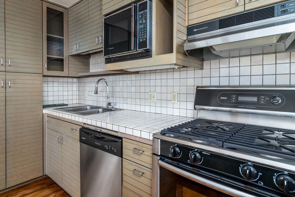 a kitchen with a stove and a sink