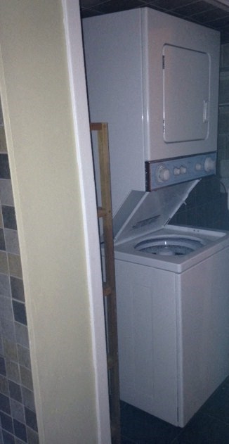 A white oven and microwave are in a kitchen.