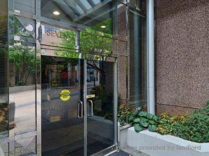 A glass door with a yellow sticker on it.