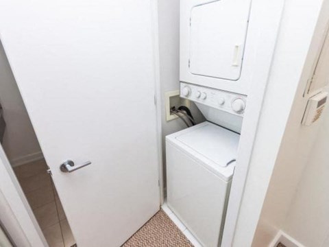 A white oven is built into a wall in a kitchen.