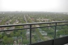 A view of a city from a balcony.