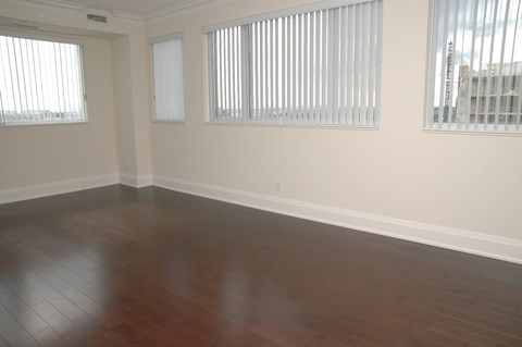 A room with wooden floors and white walls.