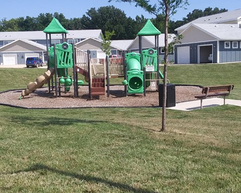 a playground at a park in a residential area