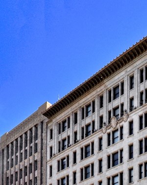 a large building on the corner of a city street