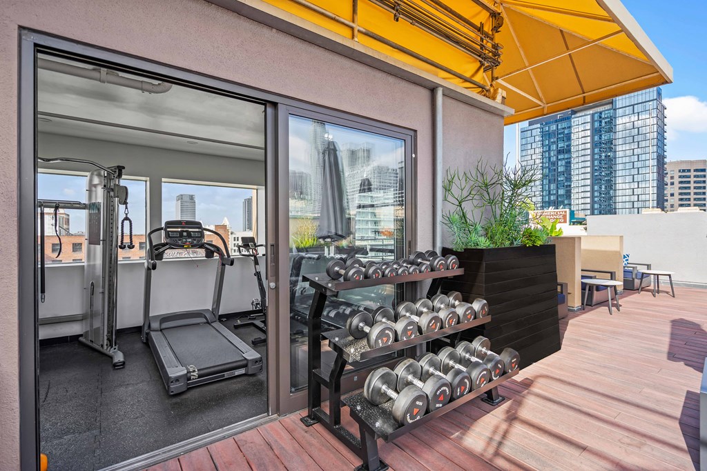 a gym with a view of the city