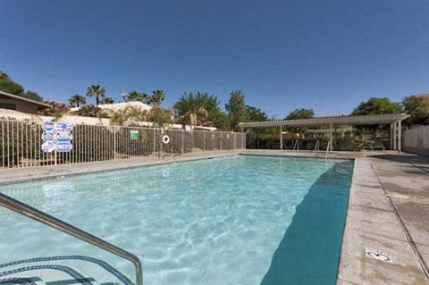 a swimming pool with a fence around it