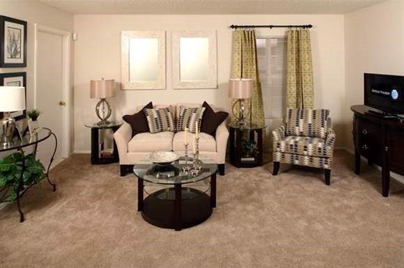 a living room with a couch and a table