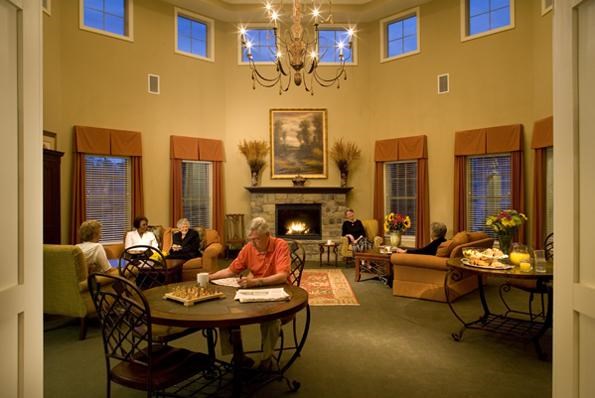 a group of people sitting in a living room