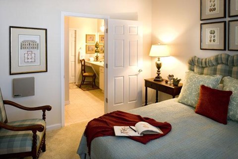 a bedroom with a bed with a book on top of it