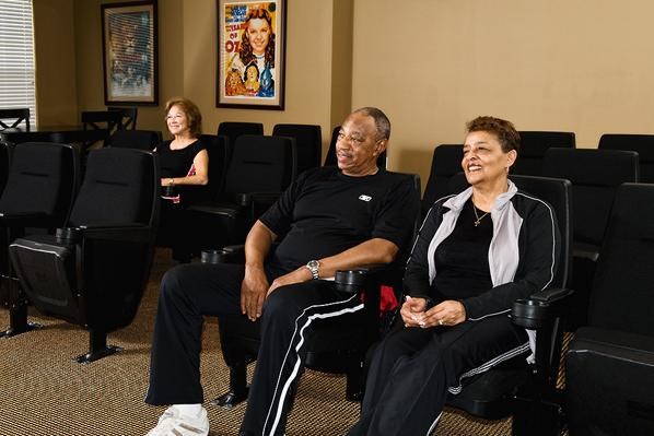 a group of people sitting in chairs in a room