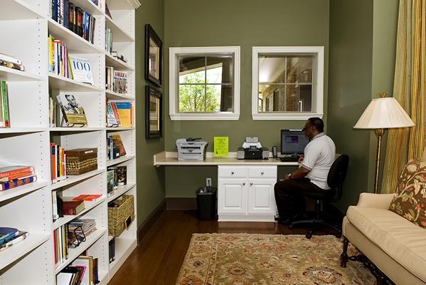 a man sitting at a desk in a home office