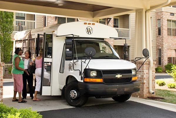 a group of people standing outside of a food truck
