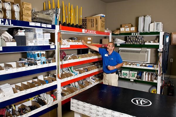 a man is standing in a shelf in a store
