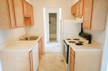 Wooden cabinets in kitchen area at Crown Pointe Apartments, Covington