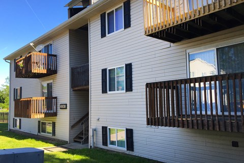 a view of the side of a house with two balconies at Oakwood Apartments, Florence, KY