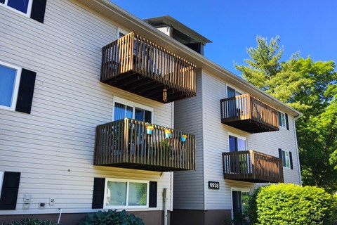 the outside of a white house with two balconies at Oakwood Apartments, Florence, 41042