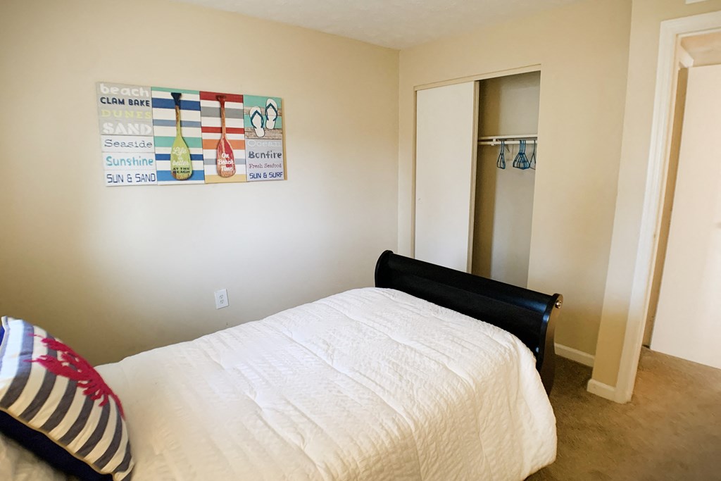 Bedroom with cozy bed at Oakwood Apartments, Kentucky