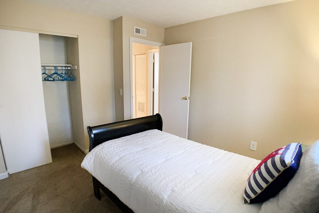 Bedroom with cozy bed and cabinets at Oakwood Apartments, Kentucky, 41042