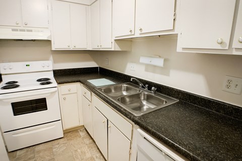 Kitchen with cabinets and appliances at Oakwood Apartments, Florence