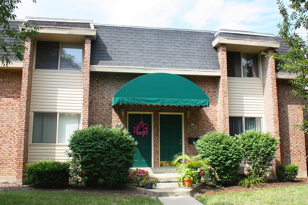 the front of a house with a green awning at Wentworth Estates Apartments, Kentucky