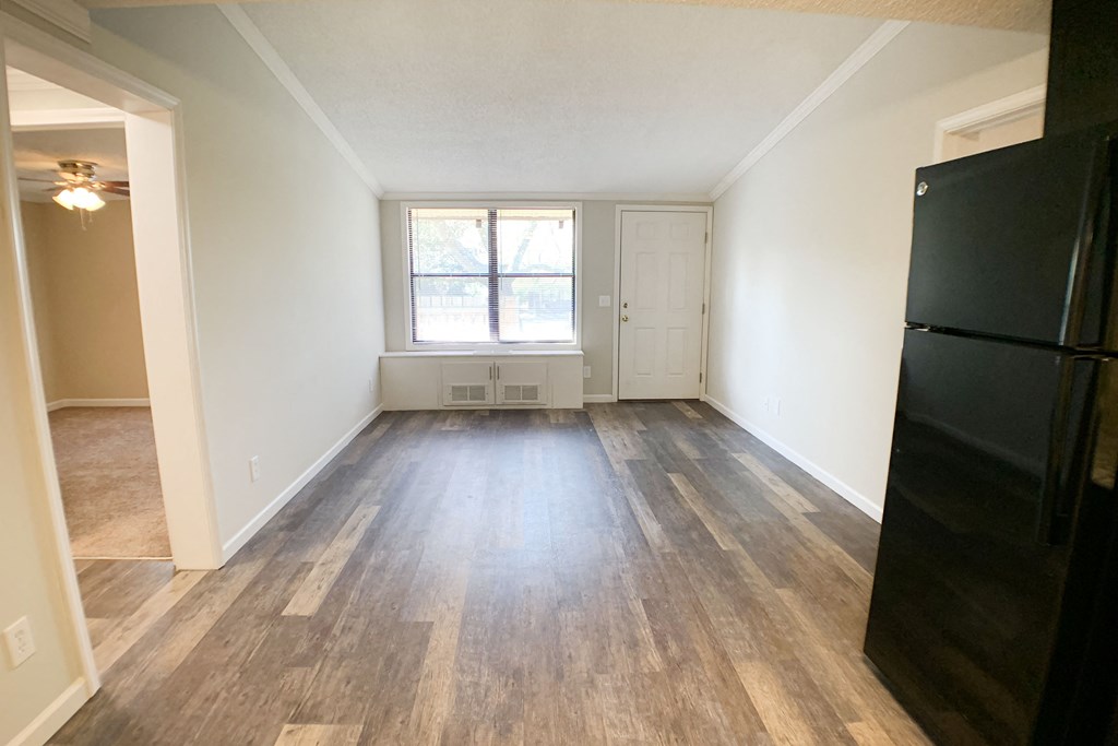an empty living room with wood floors and a window at Wentworth Estates Apartments, Florence, 41042