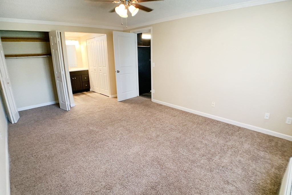 an empty living room with a closet and a ceiling fan at Wentworth Estates Apartments, Florence, 41042