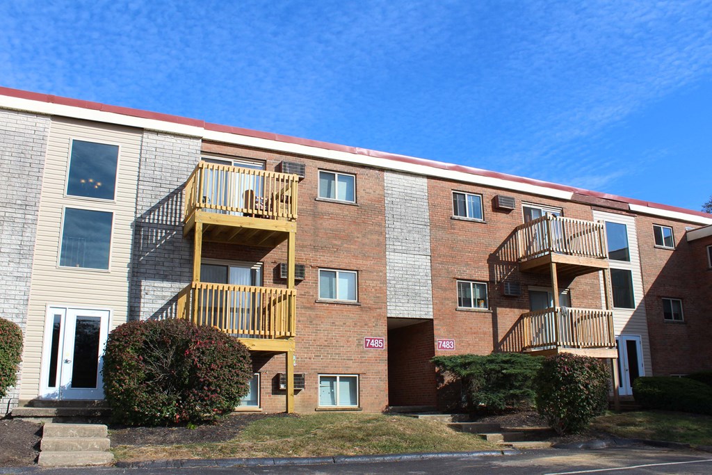 a brick apartment building with three balconies  at Wentworth Estates Apartments, Kentucky