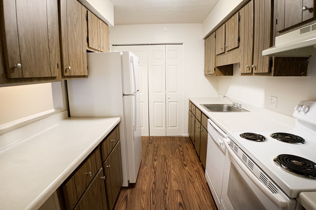 Kitchen Designed With Ample Storage Space  at Concord Woods Apartments, Milford