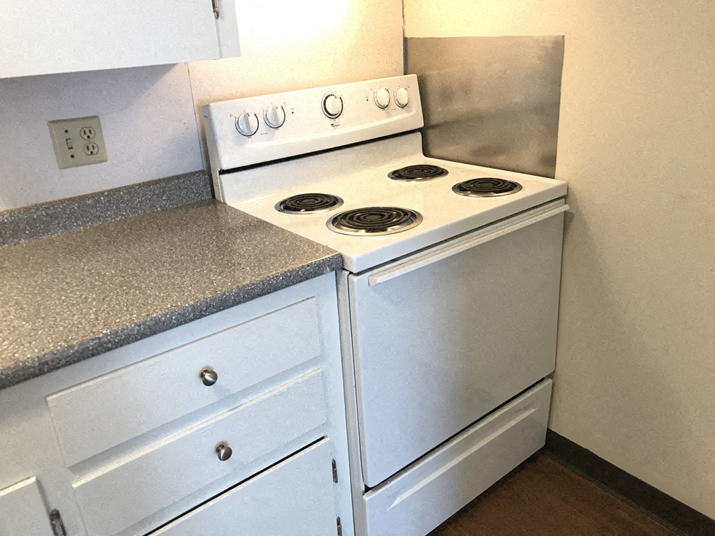 a kitchen with a stove and a counter top