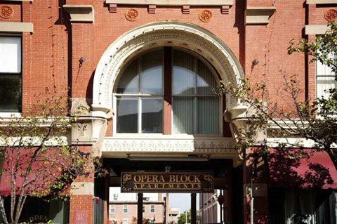 a building with a sign for the opera block apartments