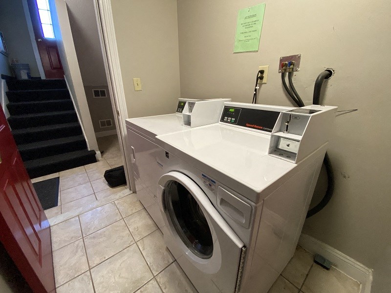 a washing machine and a sink in a laundry room