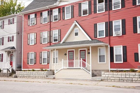a red house with a white front porch