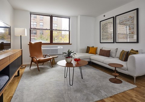 a living room with a couch and a table