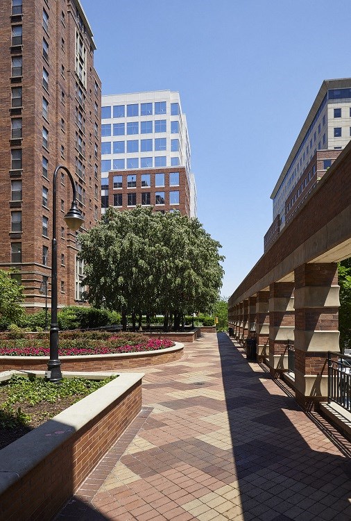 a walkway between two tall buildings in a city