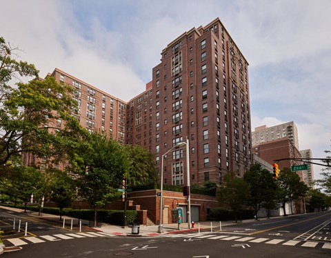 an empty street in front of a tall building