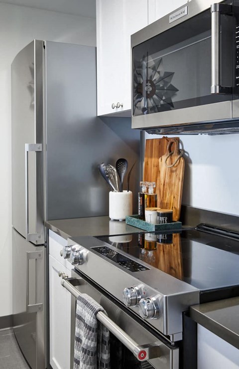 a small kitchen with a stove and a microwave