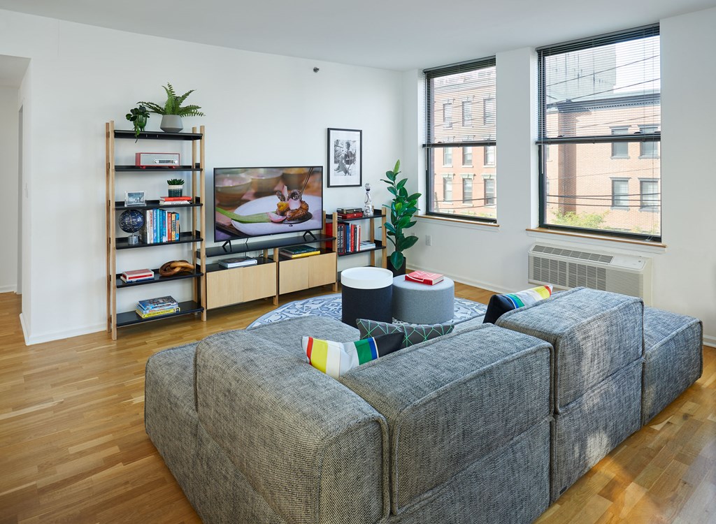 a living room with a couch and a tv