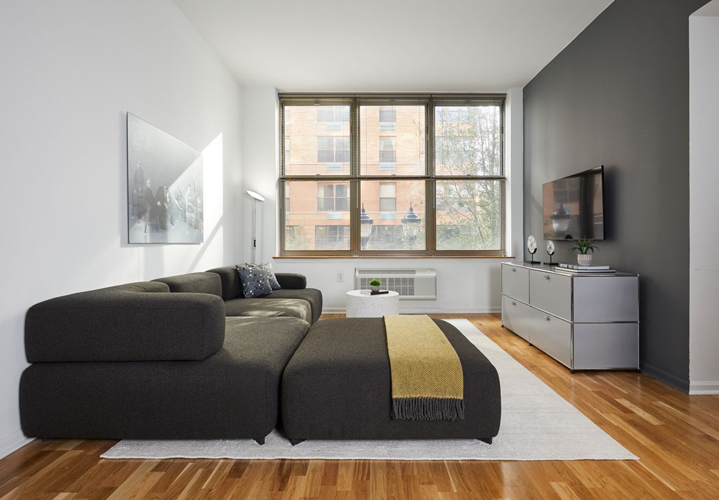 a living room with a couch and a window