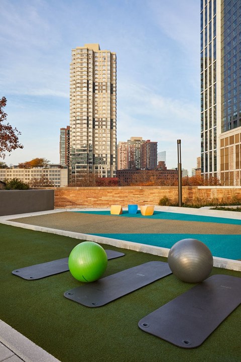 a view of a city skyline with an outdoor ping pong court