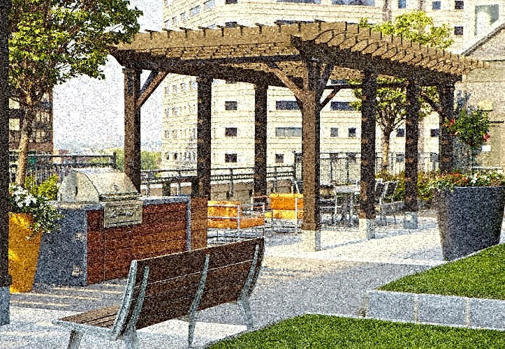 a picnic area with a grill and a pergola