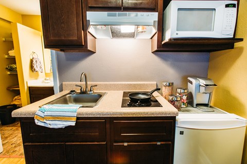 a kitchen with a sink and a microwave