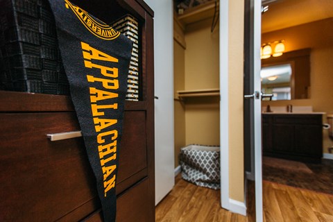 a bedroom with a door with a wrestling sign on it