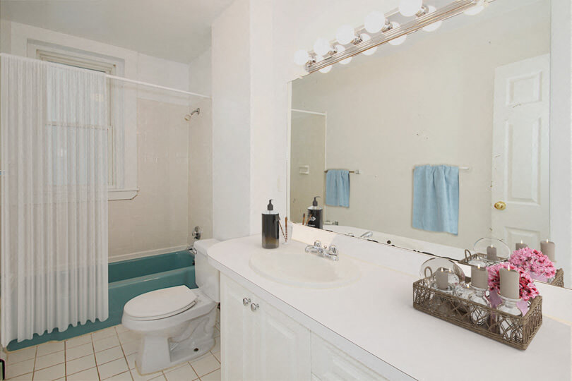 a bathroom with a sink toilet and a mirror