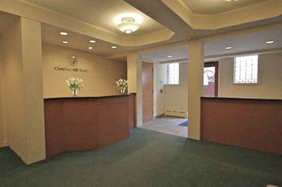 the lobby of a building with a reception desk