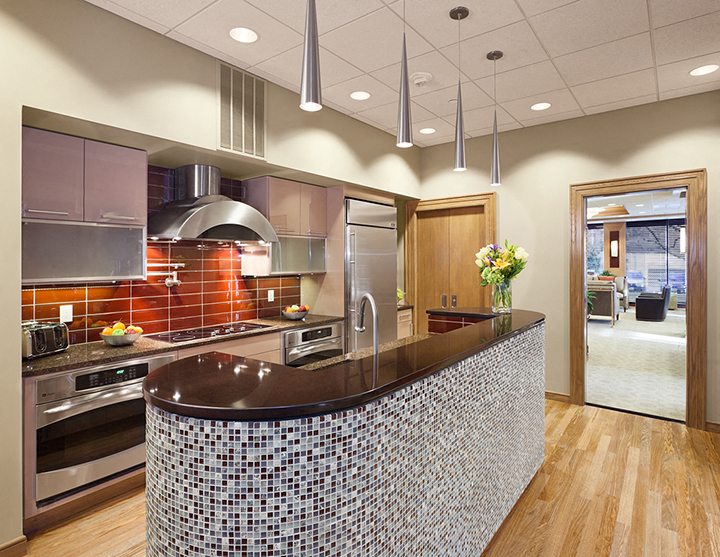 a large kitchen with a large counter top and a stove