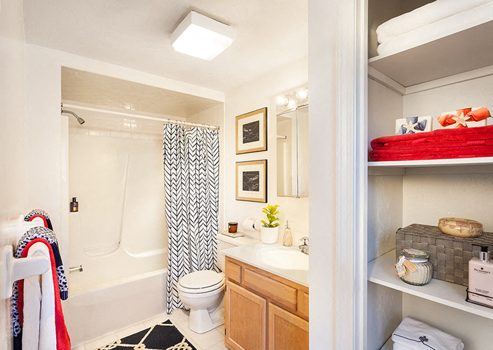 a bathroom with a shower toilet and sink and a shower curtain