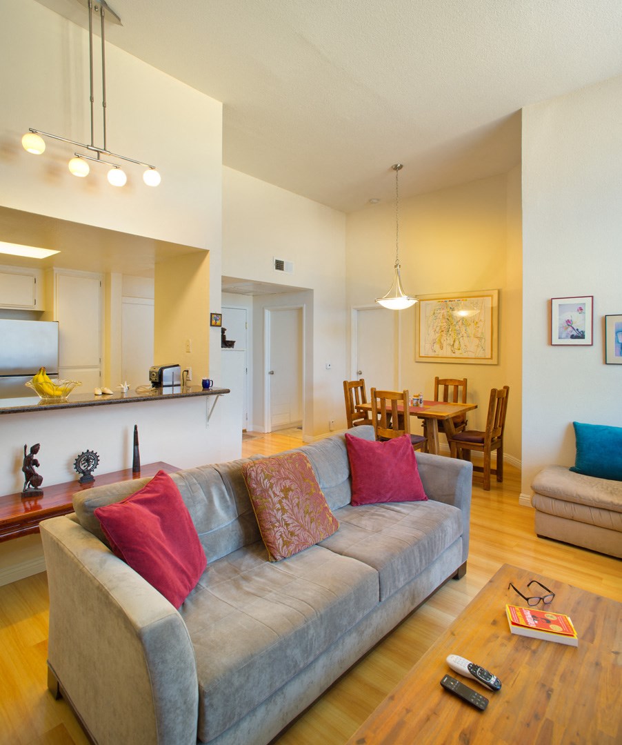 the living room is open to the kitchen and dining room