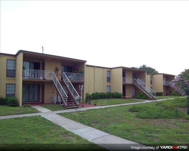 an apartment building with two sets of stairs